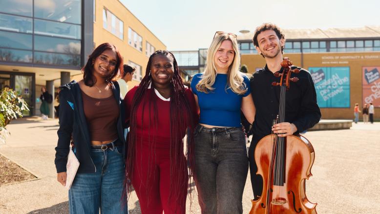 group of friends smiling on surrey campus