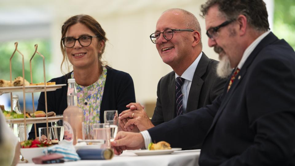 Three graduation guests sitting at a table enjoying afternoon tea