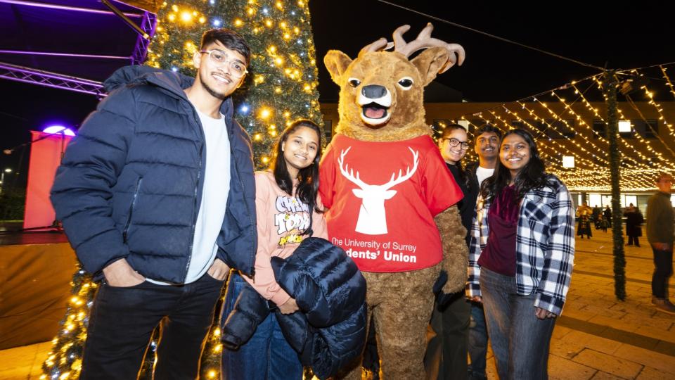 Students posing for a photo with Steve the Stag