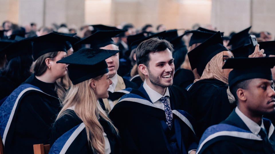 Graduands sitting in their seats at a ceremony