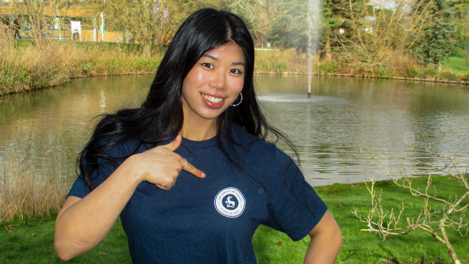 A student modelling a Class of 2026 t-shirt