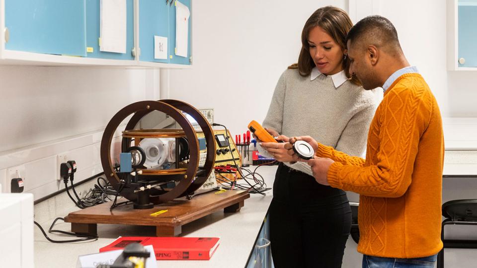 Students in physics optics lab