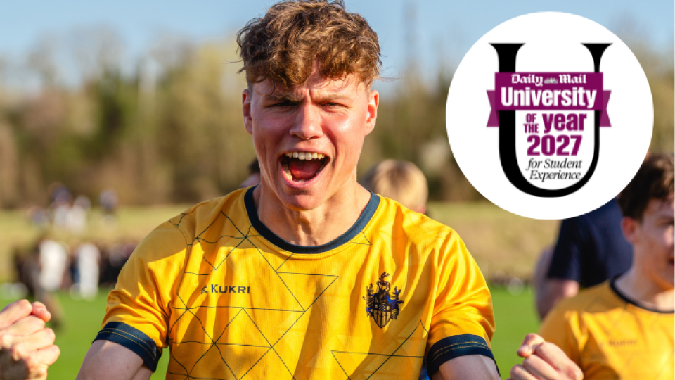 A Team Surrey footballer player celebrating, with the Daily Mail University of the Year for Student Experience logo