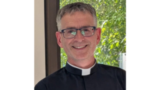 Head and shoulder image of Rev Paul with glasses